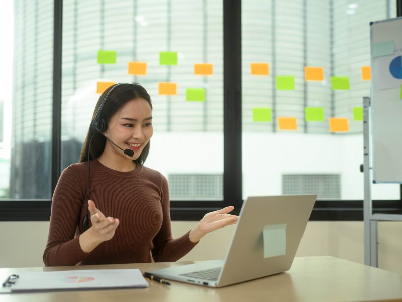 customer-service-representative-in-headset-consulting-for-digital-marketing-with-client.jpg